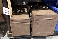 Two brown Waterloo Industrial metal toolboxes on a shelf. One labeled 'Drill + Bits'.