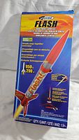 Front of the box showing the Estes Flash model rocket and launch set details and branding.