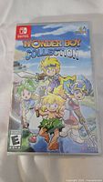 Front cover of the Wonder Boy Collection game for Nintendo Switch showing the title and main characters.