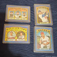 Four Topps Heritage Blue Sparkle baseball insert cards displayed together on a dark fabric surface, showing front designs of both rookie stars and all-star players.