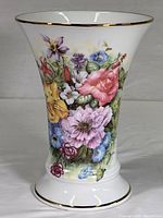 Full view of the vase showing floral hand-painted design and gold rim.