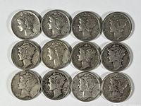 Top view of the 12 Mercury silver dimes showing the obverse side with Liberty heads in winged cap design.