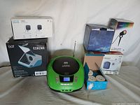 Full lot showing all items including boxed electronics and small household appliances.