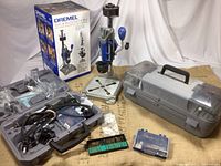 Overview of Dremel kit showing workstation, carrying case, and accessory cases