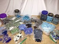 Overview showing jars and bags of assorted glass mosaic tiles