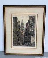 Overall view of framed etching showing mat, frame and hanging wire