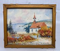 Frontal view of framed watercolor painting showing church, fence, foliage and signature