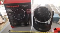 Front view of Honeywell TurboForce Power Heater with original box showing product name and image.