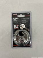 Front view of sealed U-Haul storage lock packaging showing lock and 2 keys.