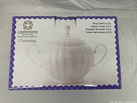 Box front showing an image of the white fine bone china soup tureen with handles and lid. Capacity marked as 3.27L, part of Cashmere Charming collection by Maxwell & Williams.