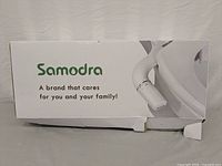 Damaged Samodra brand box showing bidet product image and branding.