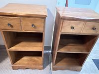 Photo of two early 1970s wooden bedroom side tables side by side, showing their drawers, shelves, and wood finish.