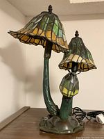Full view of double-shade mushroom lamp showing both Tiffany-style stained glass shades and base