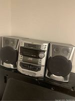 Full view of JVC MX-J56 stereo system with two speakers.