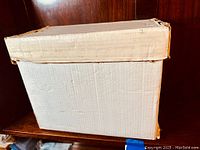 White cardboard storage box with lid