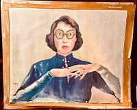 Full view of the signed watercolor portrait showing the woman in glasses and blue dress with detailed face and hand positioning.