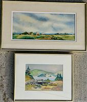Two watercolour paintings framed and hung on a wall; one rectangular landscape oriented with farmhouses, the other square with a lake and fence.