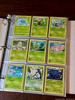 Binder page with 9 Grass Type Pokemon cards including Surskit, Weedle, Tangrowth