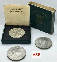 Three commemorative coins including the Festival of Britain 1951 in original case with booklet, Churchill 1965, and Queen's Jubilee 1977 coins shown together on white background.