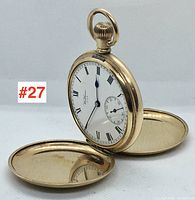 Front view of gold-filled hunter-case pocket watch with both covers open, showing dial and case lids