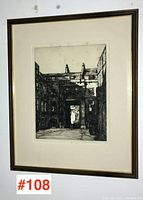 Full framed artwork showing the entire drypoint etching within a frame and matting.