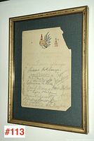 Framed autographed sheet with visible signatures and hand-colored rooster, showing missing top right corner damage.