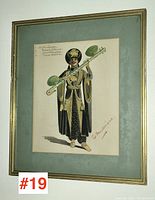 Framed costume sketch titled 'The Musicians' showing a figure in theatrical costume holding a musical instrument.