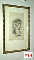 Framed pen and ink drawing hung on wall, showing overall lot appearance in gilt frame.