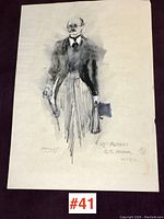 Full view of the unframed costume sketch showing the figure standing with accessories and handwritten notes.