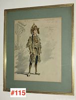 Full view of the vintage costume sketch in gold frame with light green matte.