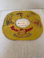 Full view of yellow circular swim tube with Howdy Doody graphics and aquatic characters
