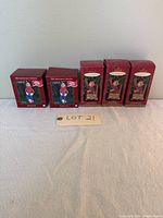 Five boxed Howdy Doody 50th Anniversary collectible ornaments in original packaging displayed on table.