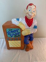 Front angled view showing Howdy Doody figure leaning on a vintage TV labeled 'The Howdy Doody Show'.