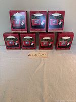 Front view of five boxed Howdy Doody Keepsake Ornaments arranged in a pyramid shape with lot number card in front, showing red Hallmark boxes with ornament image.