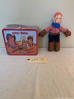 Full view of the Howdy Doody lunchbox next to the doll showing overall condition and size comparison.