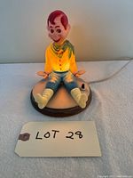 Full front view of the Howdy Doody night light, showing character seated with bright yellow shirt and green scarf.