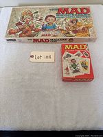 Full view of MAD Magazine board game box with cartoon characters on the cover alongside MAD Magazine card game box.