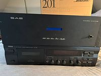 Front view showing SAE amplifier over Yamaha tape deck stacked together