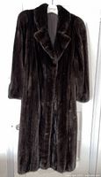 Front view of full length mink coat showing shawl collar and long sleeves