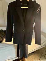 Zara Basic navy blue blazer with matching pants hanging on hanger