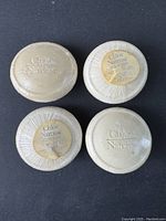 Four small round bars of Chloe Narcisse soap, shrink-wrapped with embossed logo and label on reverse side.