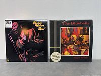 Front covers of both vinyl records: Muddy Waters 'Blues' and The Bluebells 'Sugar Bridge'