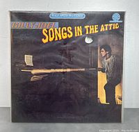 Front cover of the album showing the title and artist with image of Billy Joel.