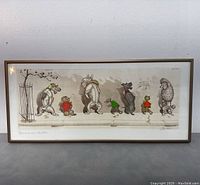 Full view of framed etching showing seven anthropomorphic dogs standing in a row on a paved sidewalk, each dog wearing colorful scarves or clothes.