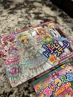 Box of a Japanese dollhouse magnetic play set featuring Hello Kitty and anime-style characters in wedding attire.