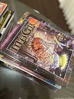 Photo showing Magic: The Gathering Roleplaying Game rulebook on top of a stack of RPG books.