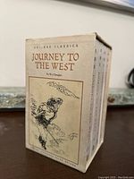 Side view of the slipcase with an illustration and title 'Journey to the West' by Wu Cheng'en.