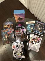 Overview of all books included in the lot displayed on a dark surface.