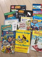 Top-down photo of all 18 assorted children's books showing titles and cover art