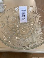 Top view of the clear crystal salad bowl showing star and floral cut patterns.